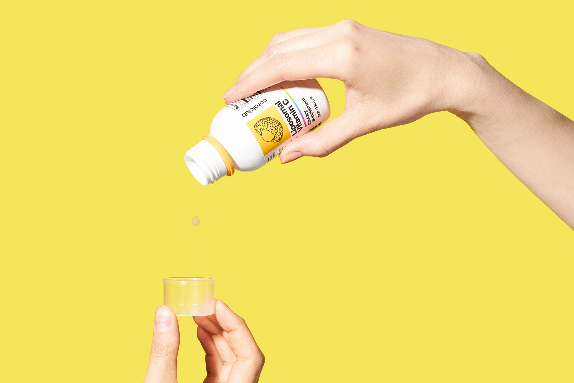 The process of carefully dispensing the liquid form of Liposomal Vitamin C product