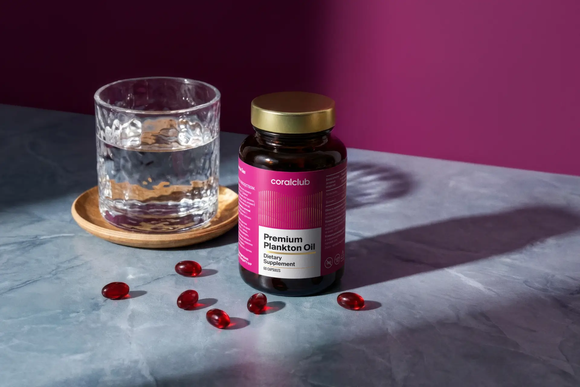 Premium Plankton Oil capsules in an aesthetic lifestyle arrangement among natural textures